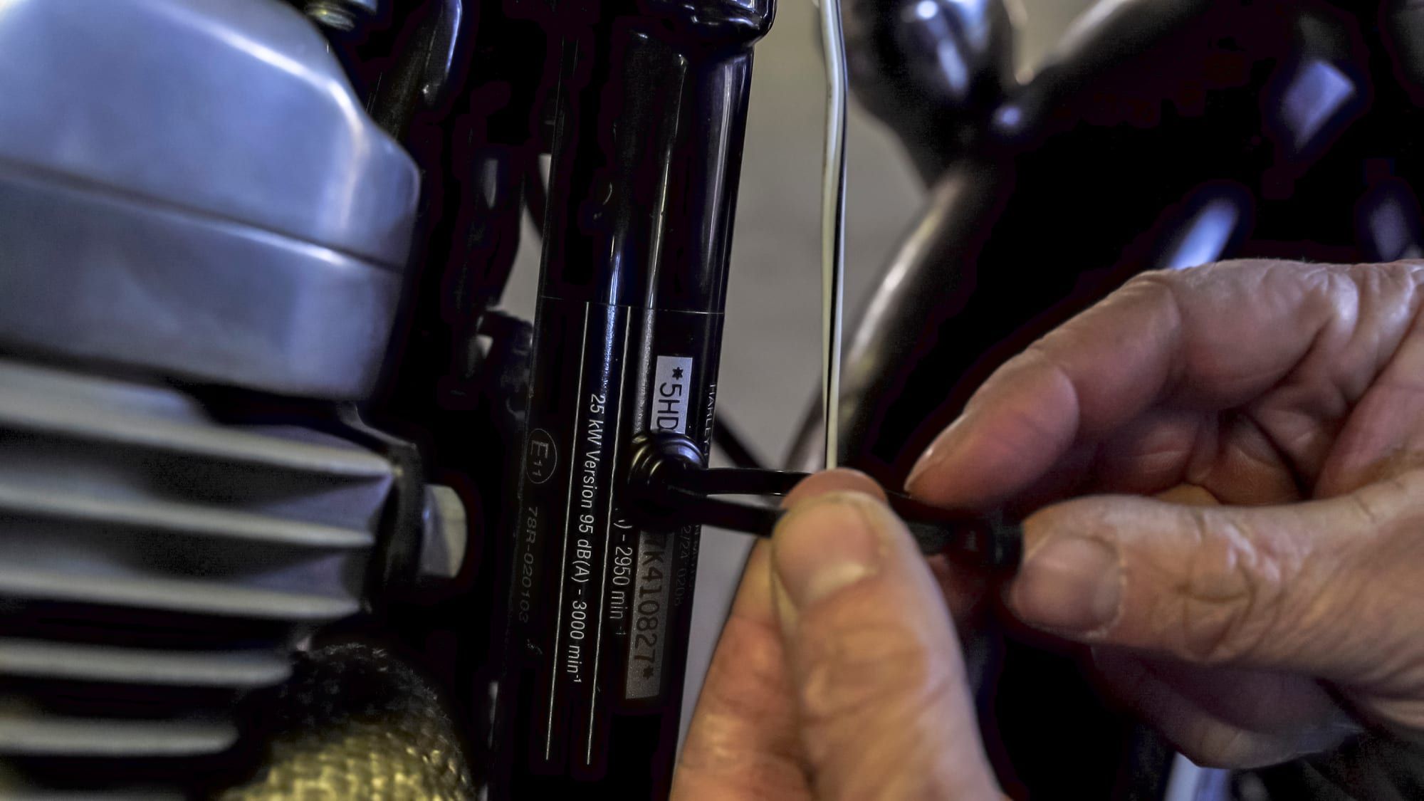 Wiring zip-tied to a magnetic mount on a vehicle frame